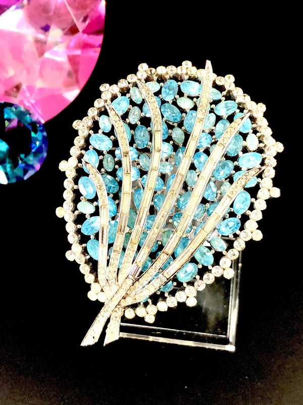 Palm frond overlay design in crystal baguettes