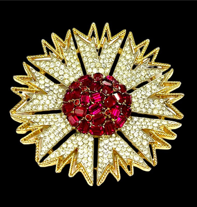 Open work dimensional starburst with fuchsia rhinestone mosaic