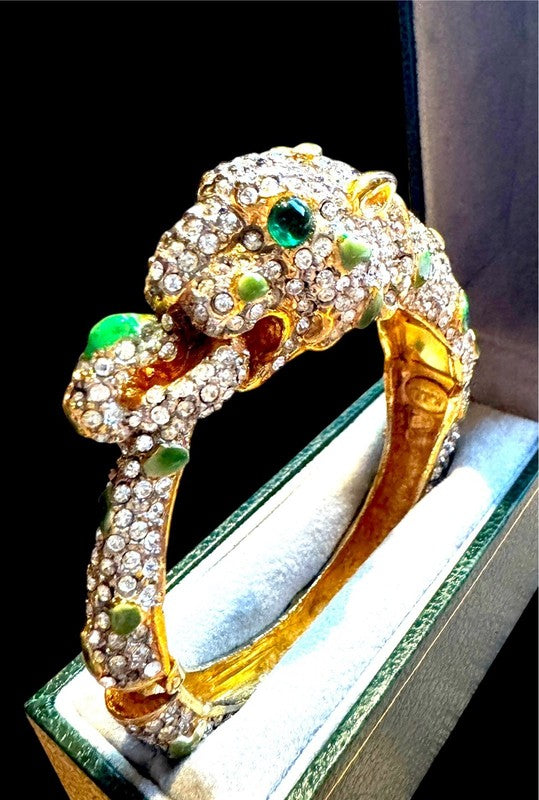 Hundreds of pave rhinestones across the cuff