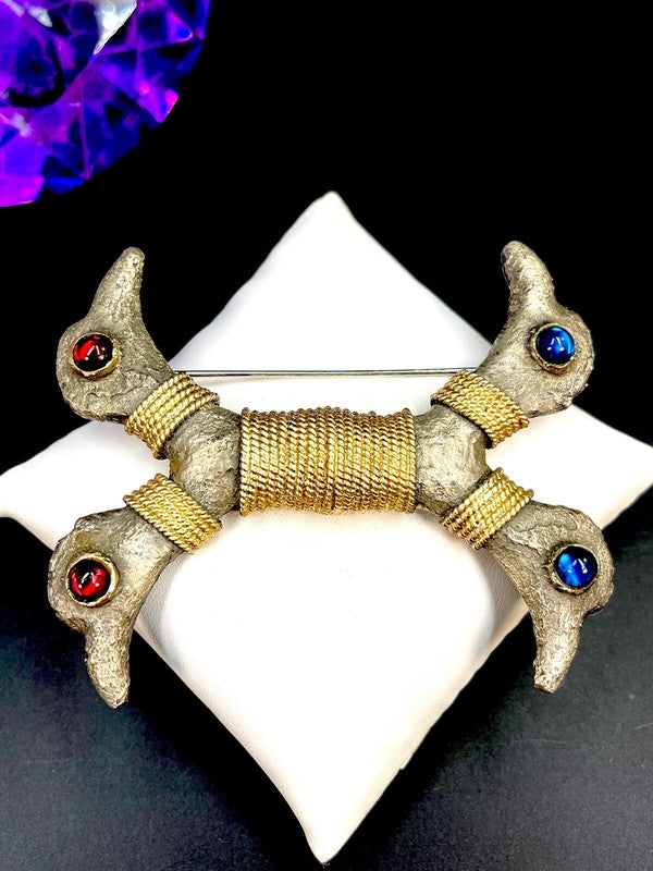 Ruby red and sapphire blue glass cabochons as the birds' eyes