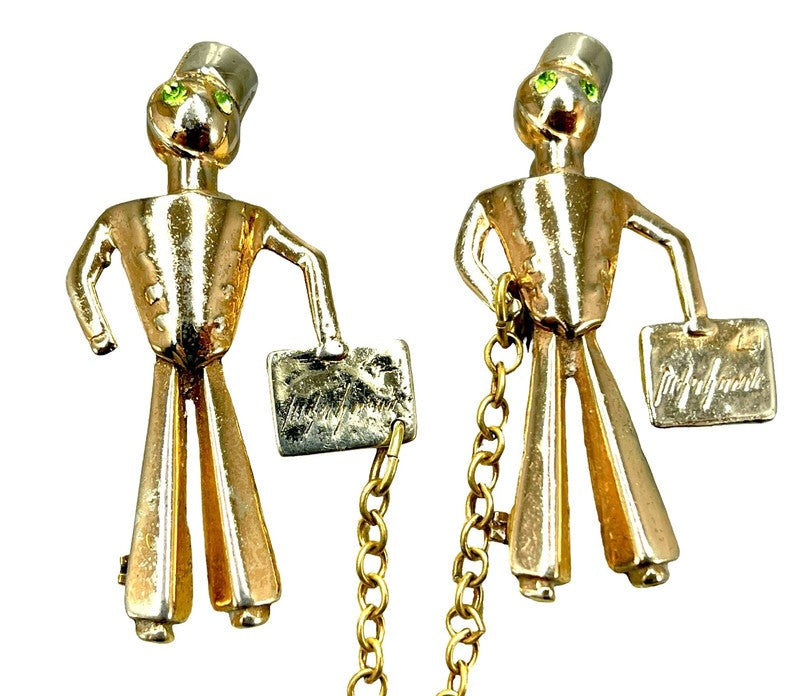 Pair of bellhops joined by the chatelaine chain