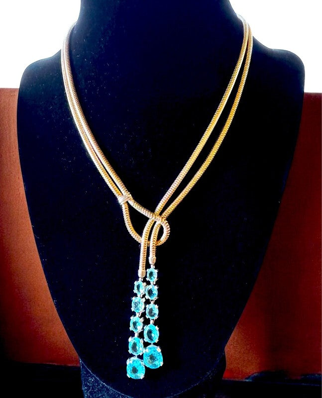 Graduated baby blue oval rhinestones down the lariat drop